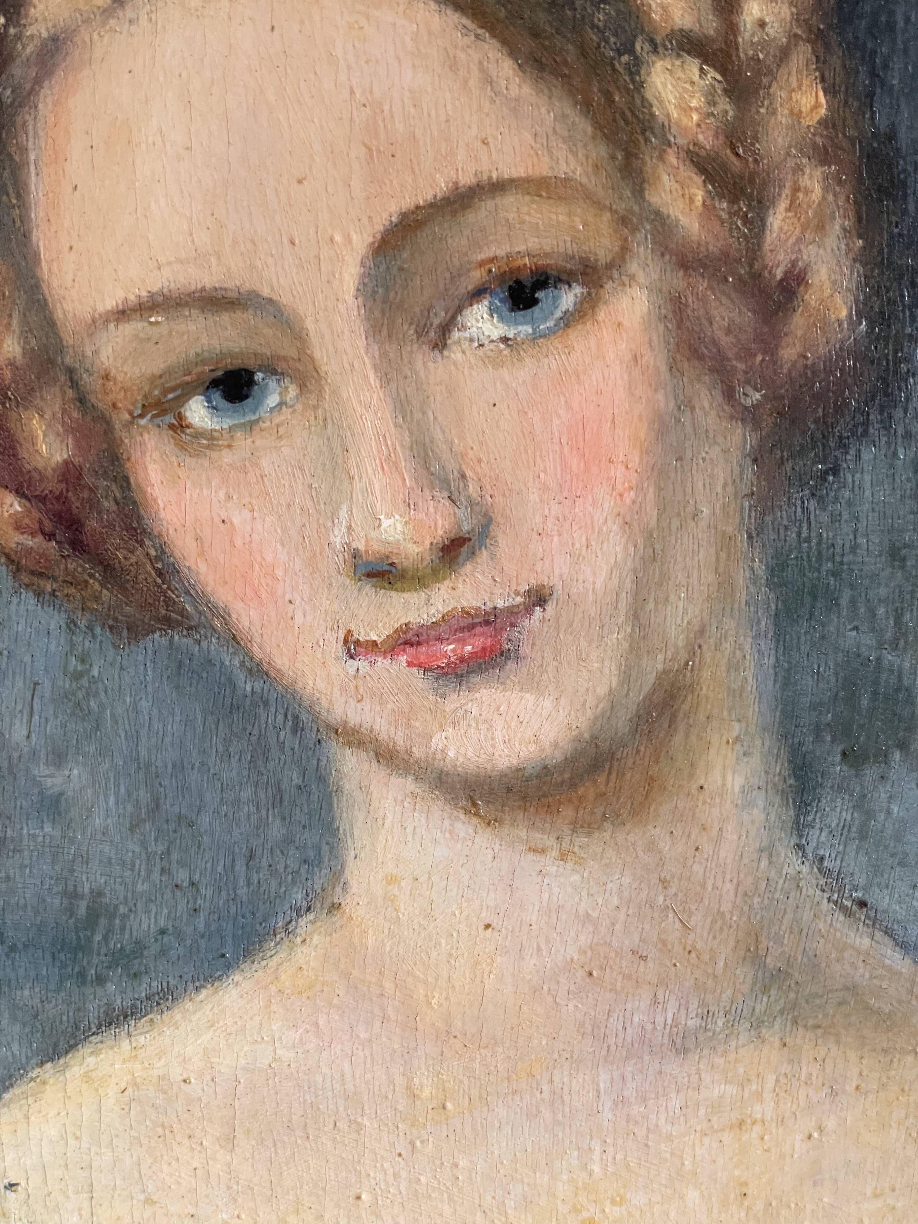Portrait of young woman painting on wood