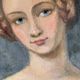 Portrait of young woman painting on wood
