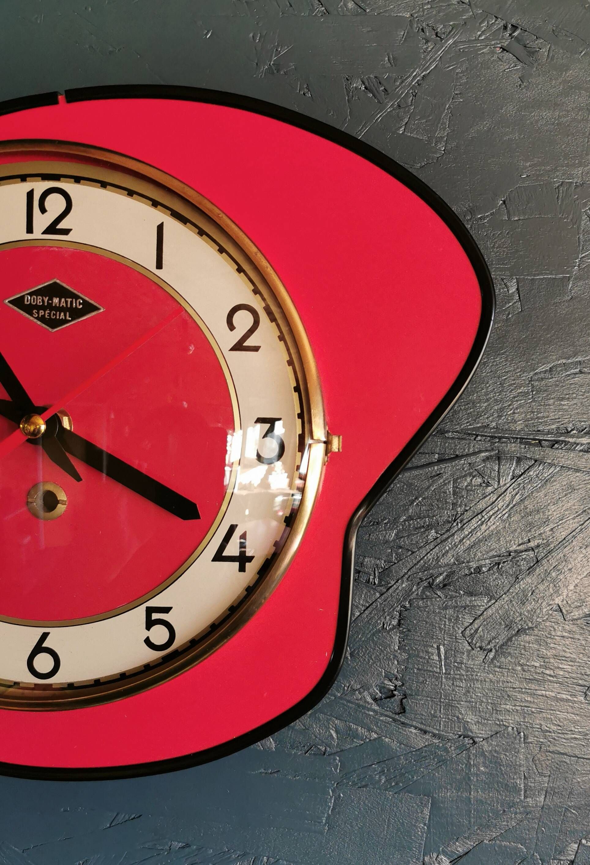 Vintage formica clock silent asymmetrical wall pendulum "Doby Matic red"