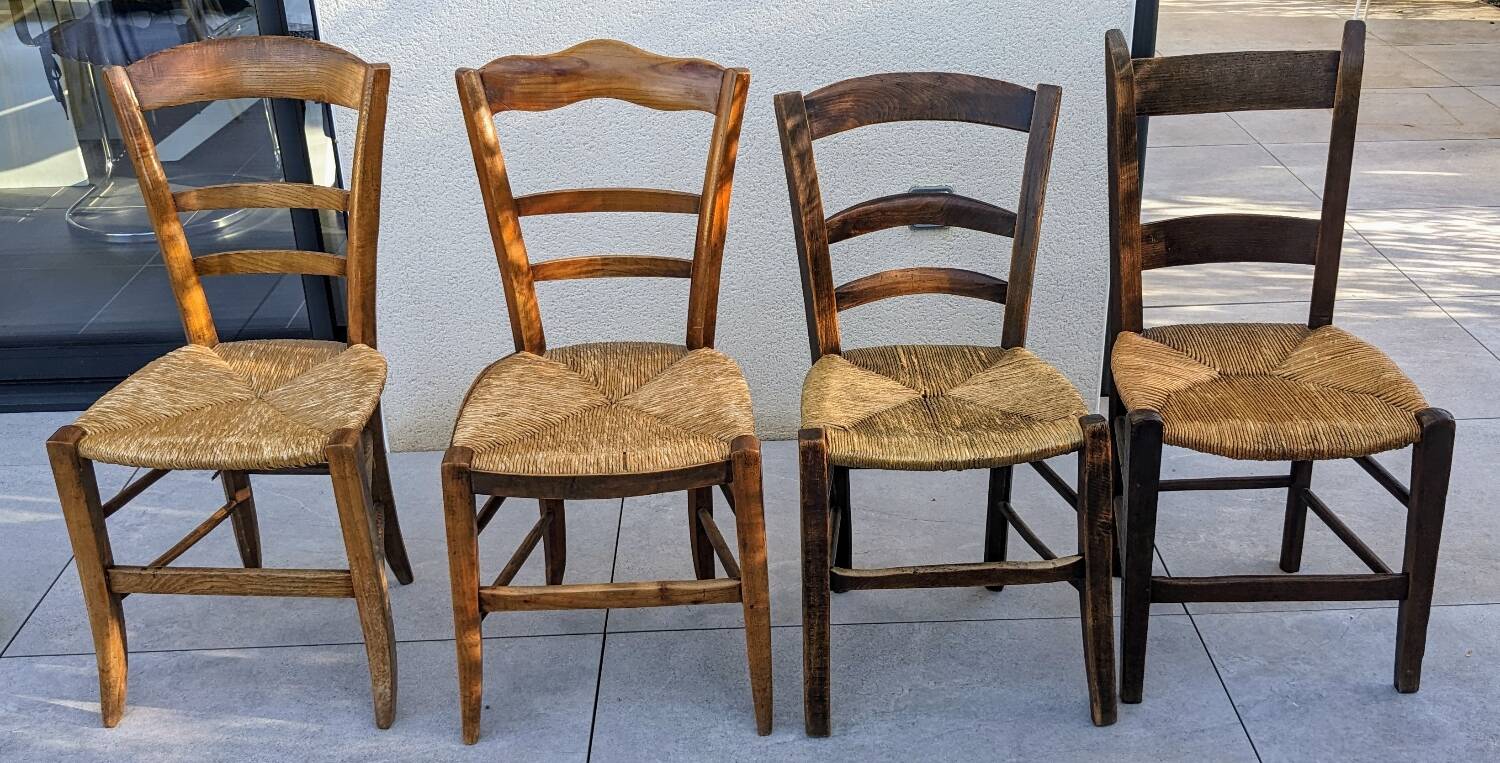 4 mismatched wood and straw chairs