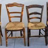 4 mismatched wood and straw chairs