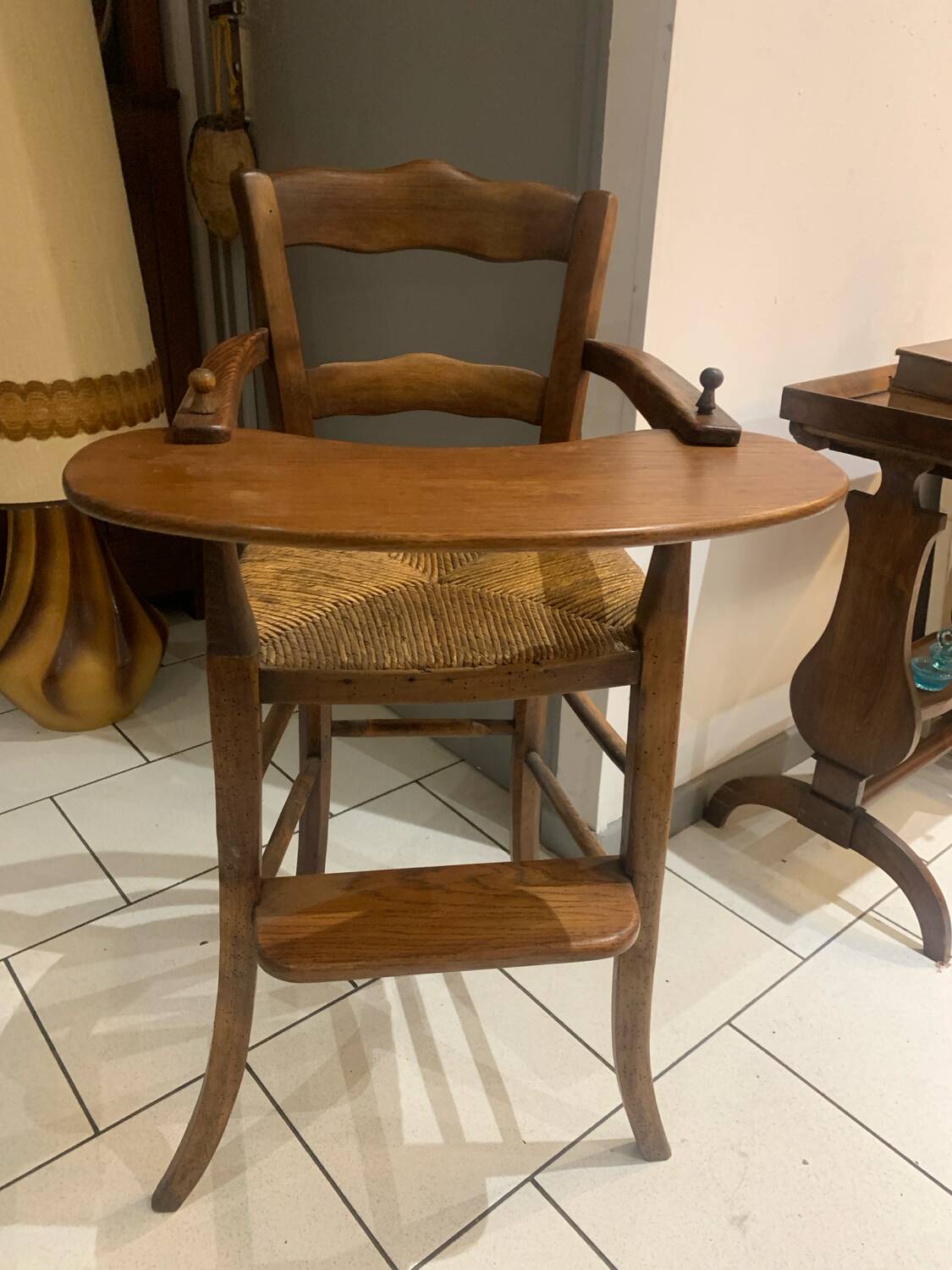 Antique straw-covered high chair