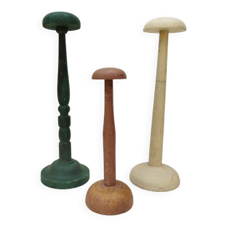 Three vintage milliner's wooden hat racks