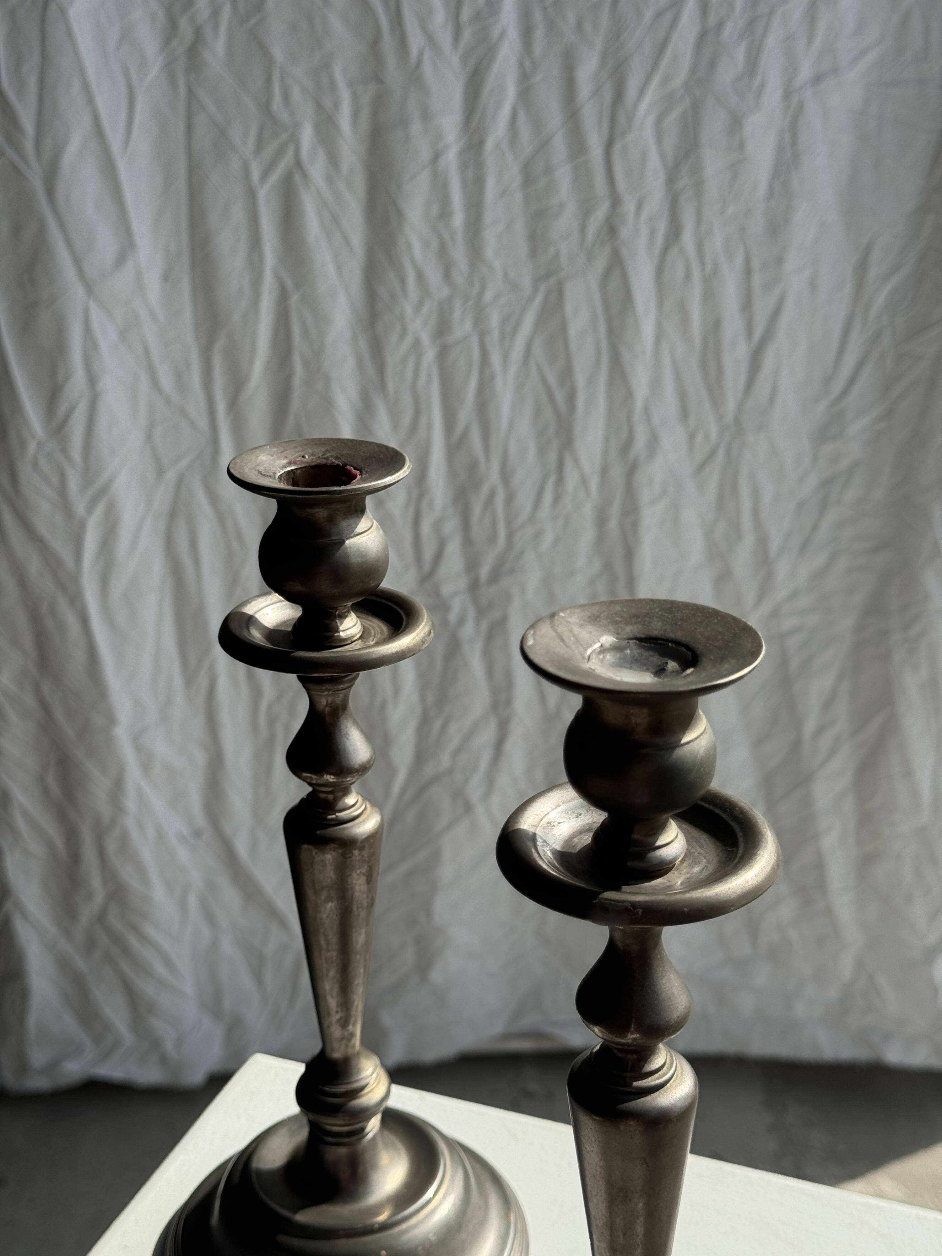 Two large antique silver-plated metal candlesticks, H30