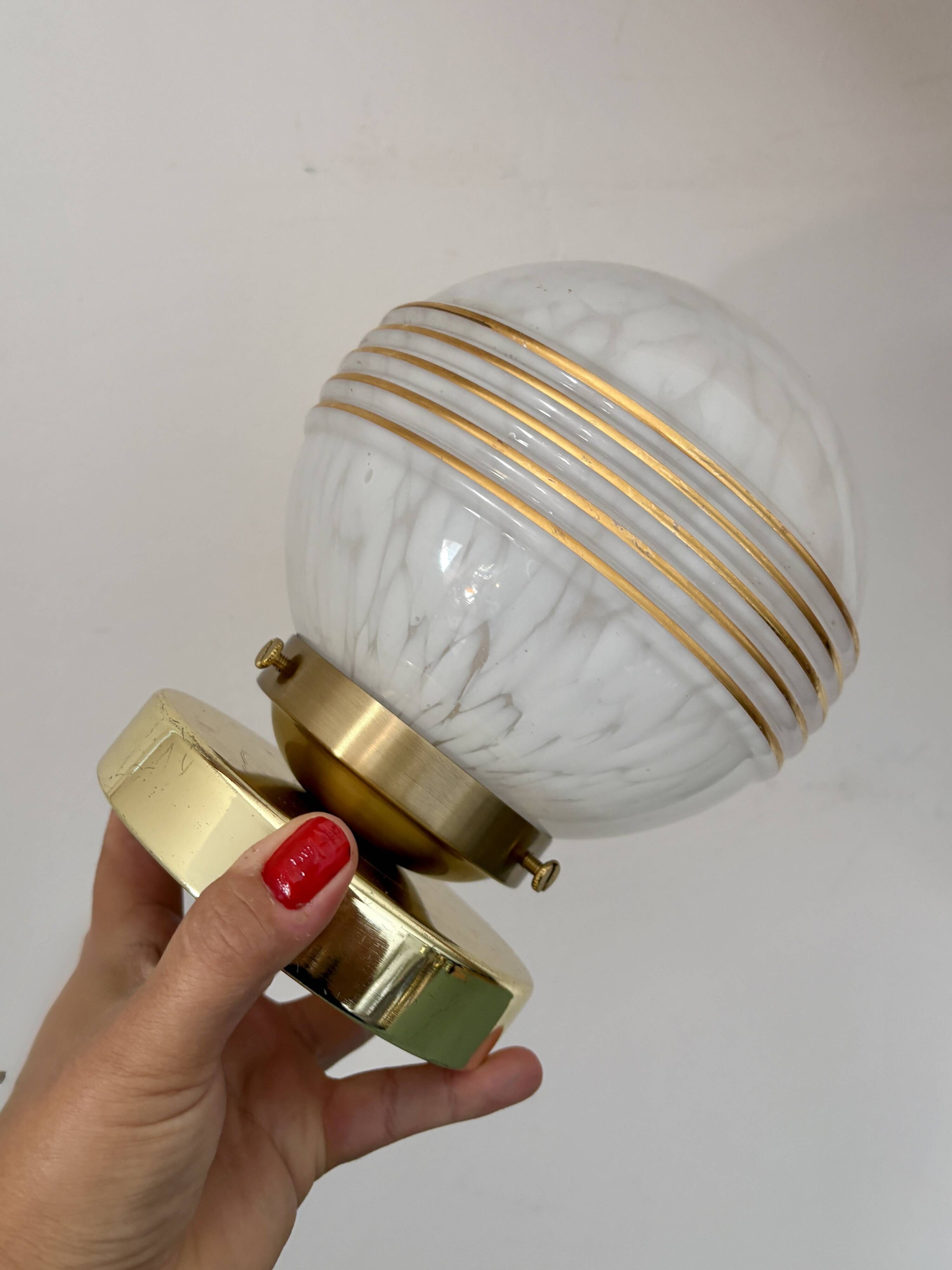 Vintage glass globe wall or ceiling light in white and gold from Clichy.