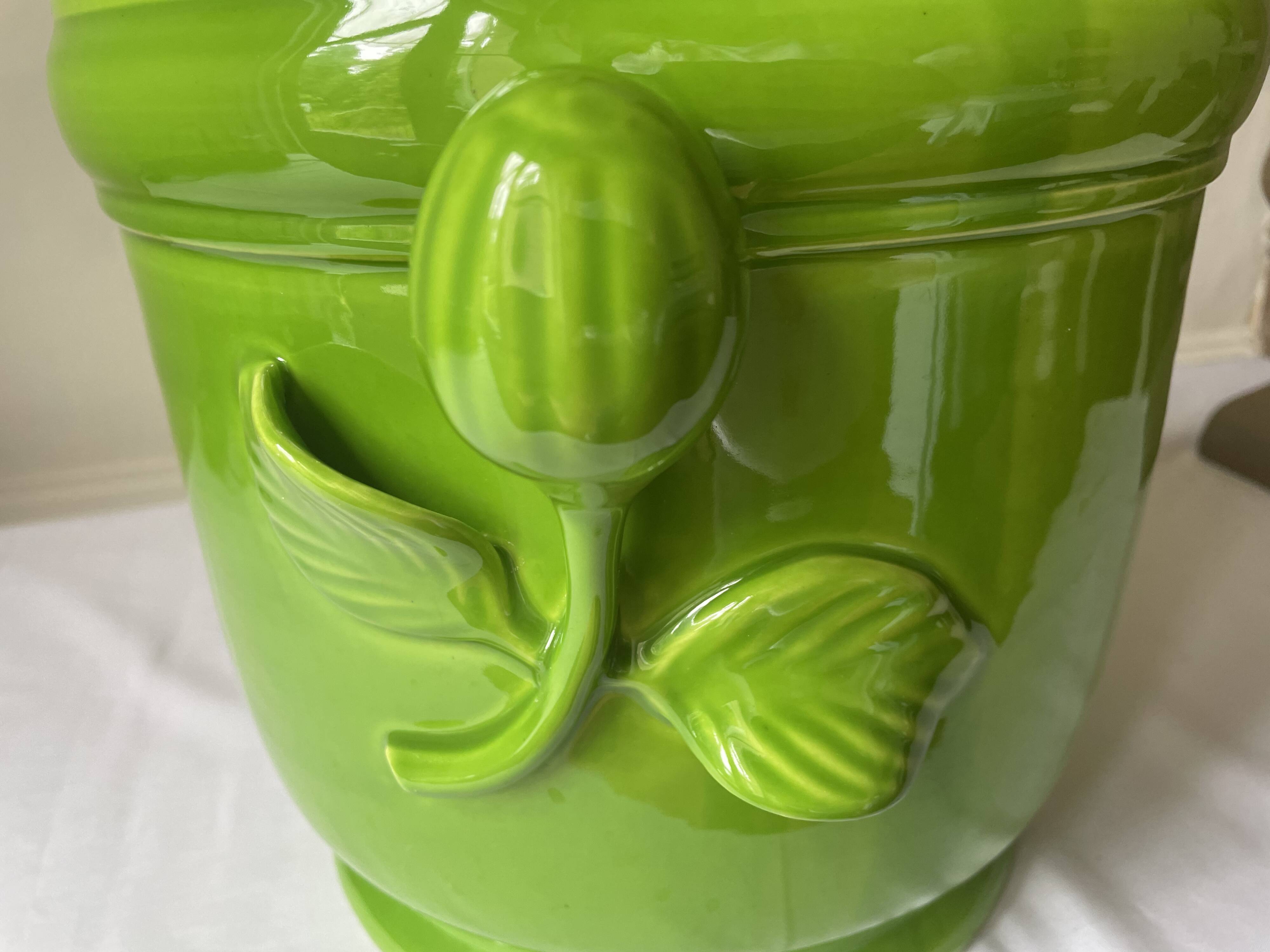 Glazed green pot cover in the style of Moreau Bourg earthenware