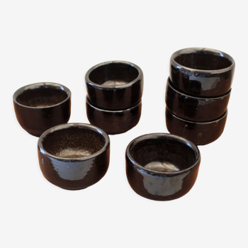 Set of 8 black ceramic cups signed