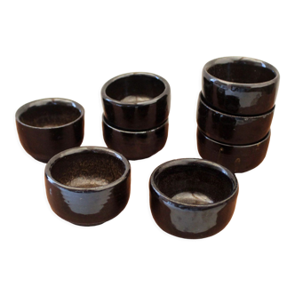 Set of 8 black ceramic cups signed