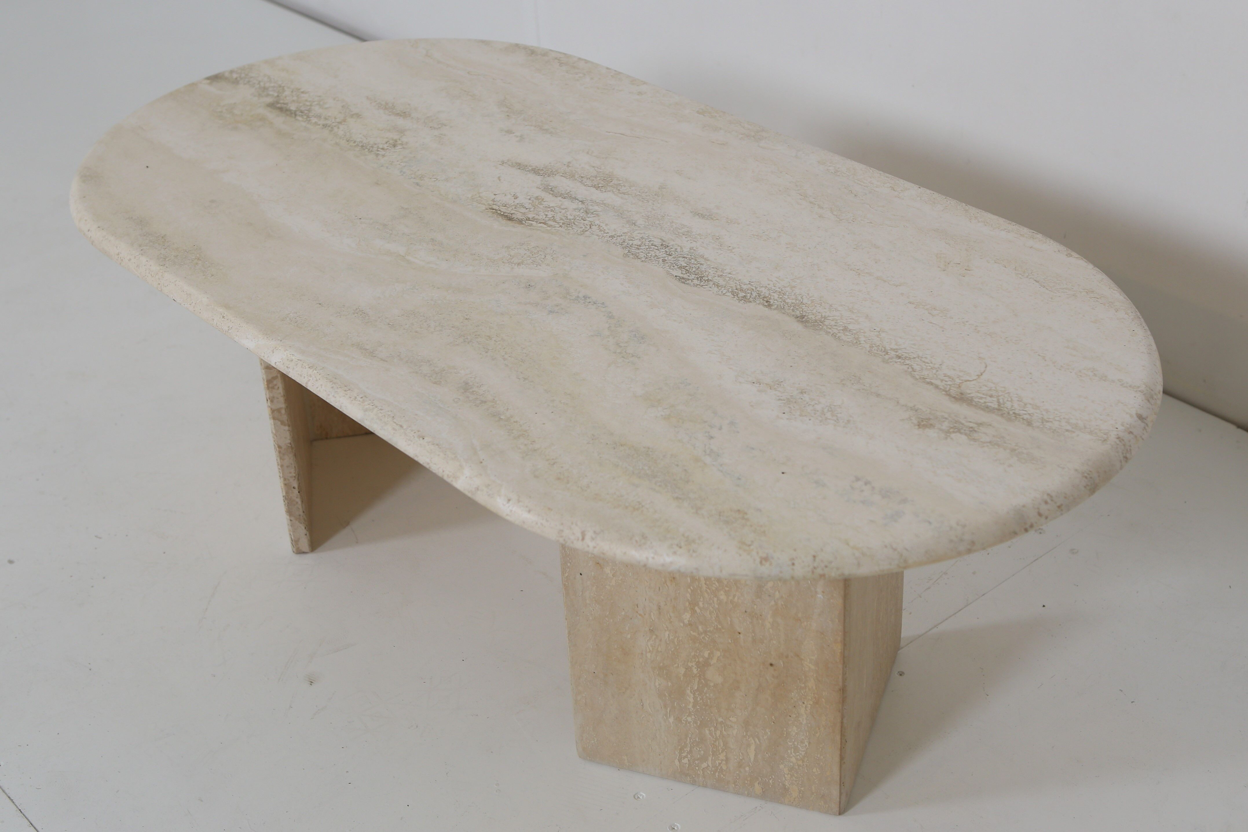 Oval travertine coffee table