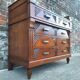 Art Deco commode with marble top, vintage antique furniture.