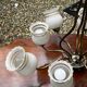 Vintage 8-light chandelier in brass and frosted white and gold glass.