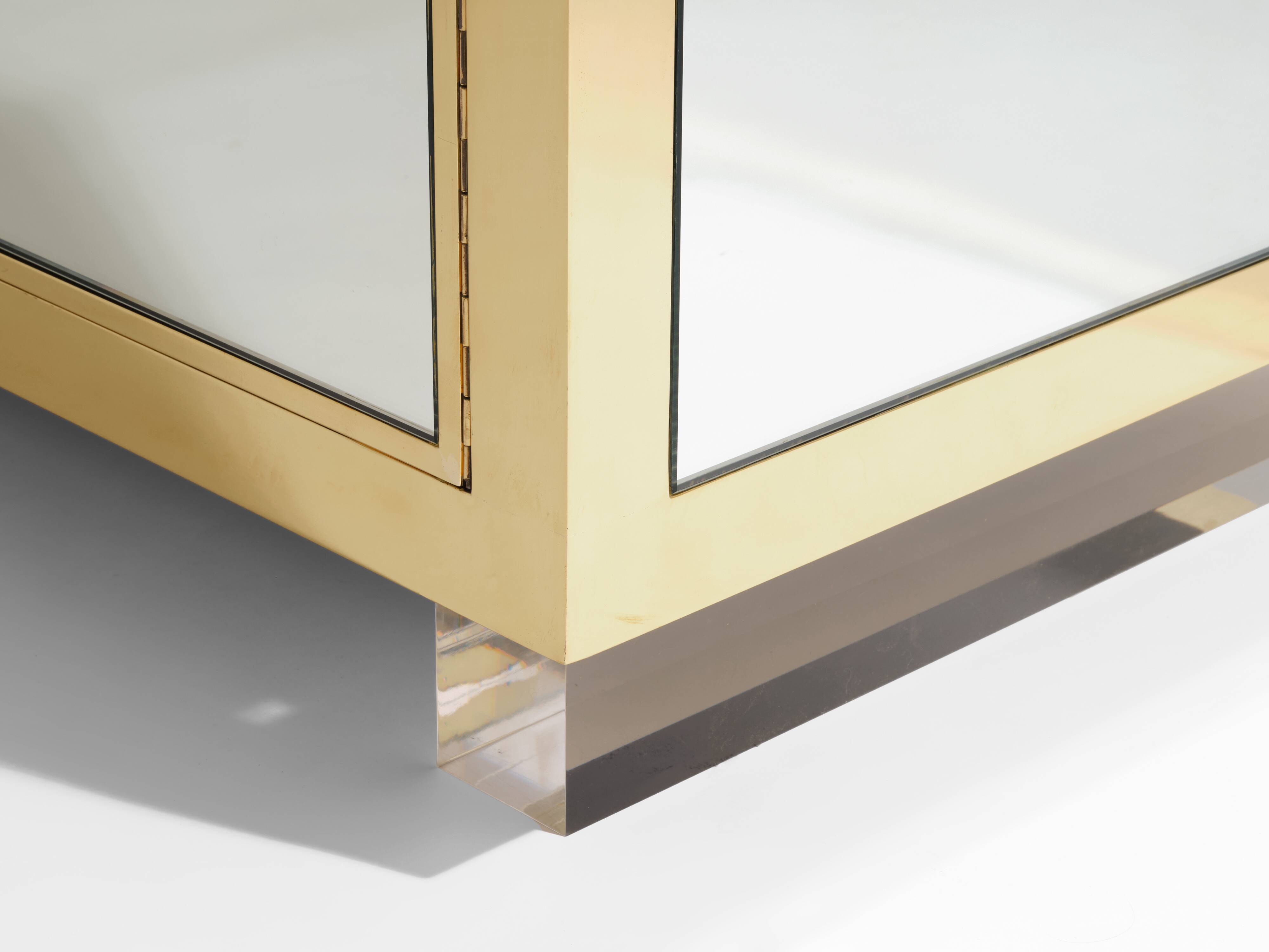 Brass sideboard with mirror and plexiglass legs by Michel Pigneres, 1970