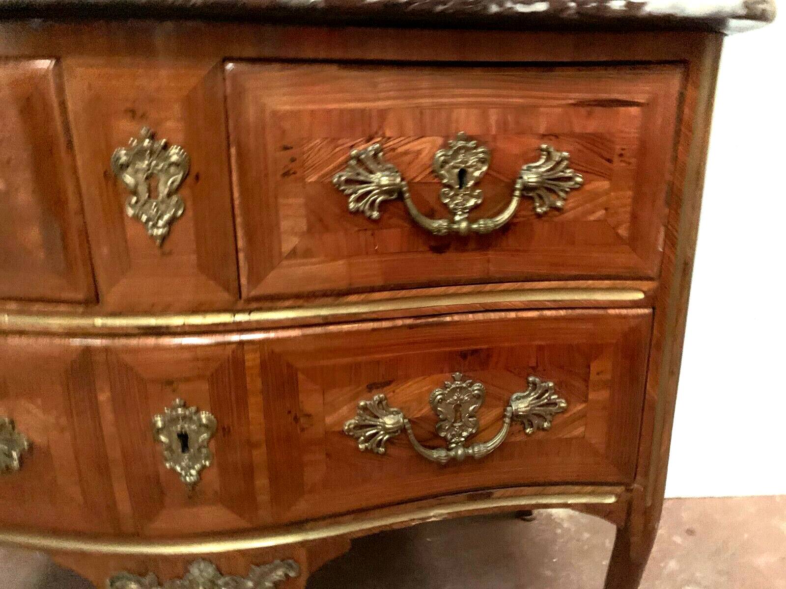 Louis XV saute chest of drawers with curved facade 18th century