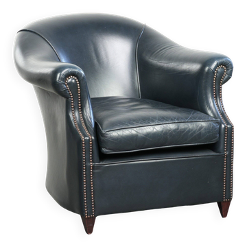 Dark blue cowhide club armchair with a unique and timeless design