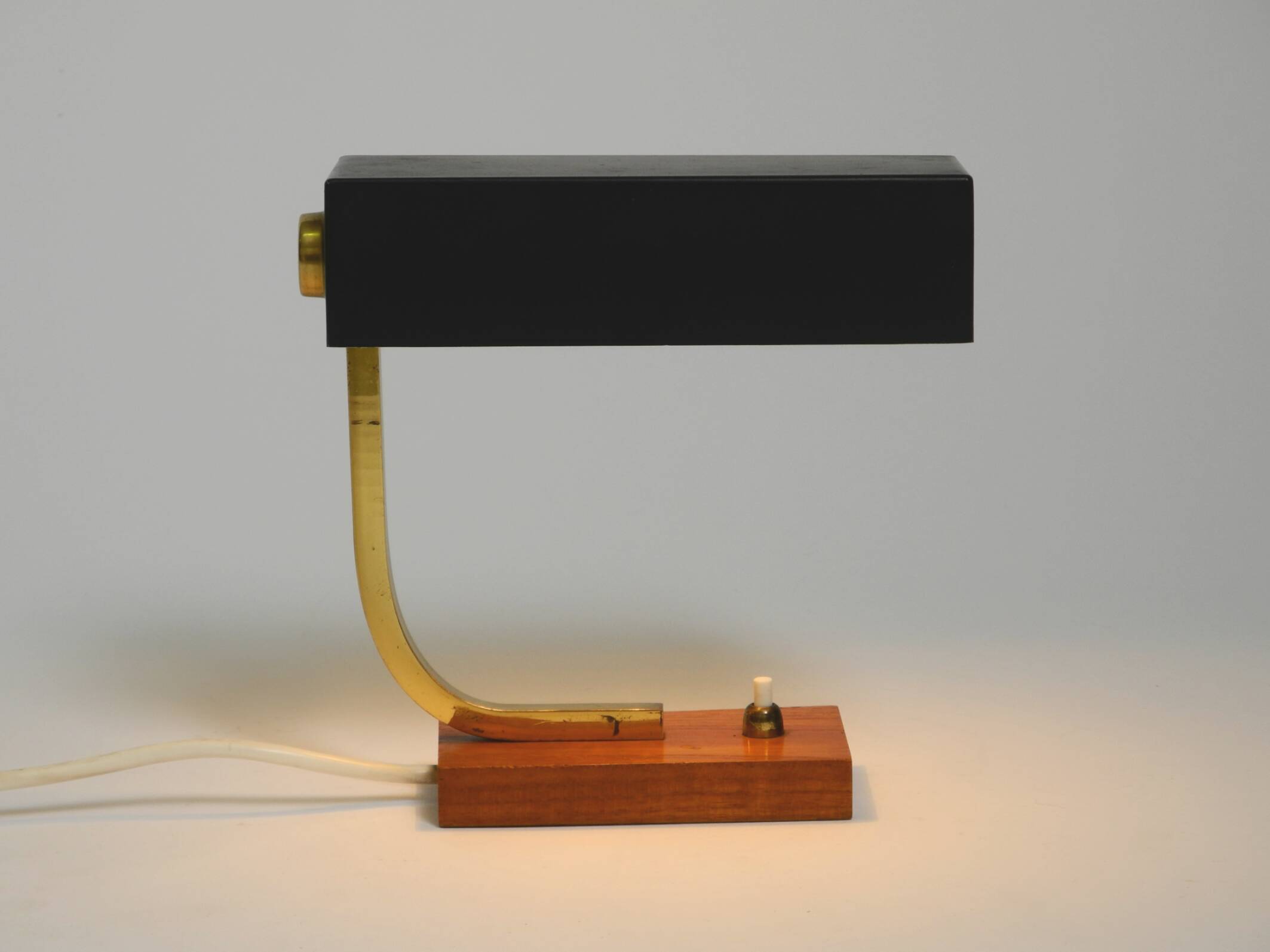 Beautiful small Mid Century Modern metal and brass table lamp with teak bas