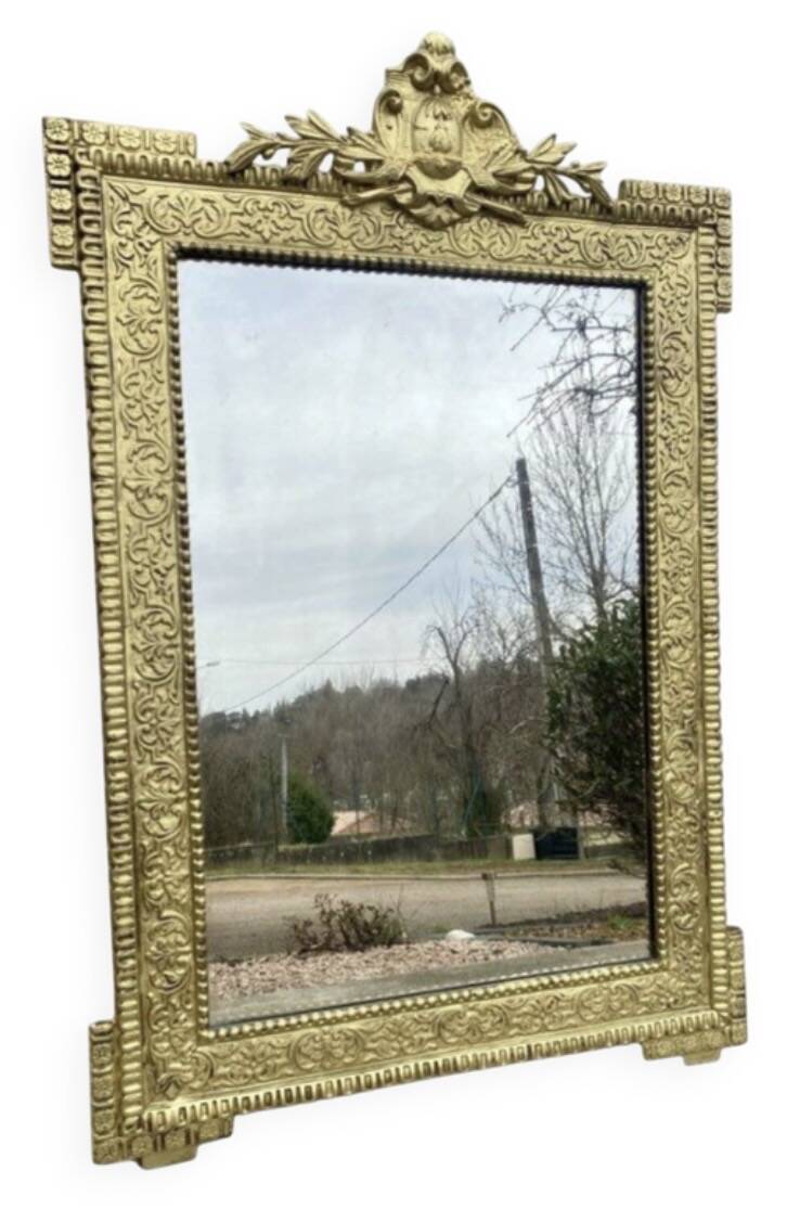 19th-century antique mirror in carved gilded wood, Napoleon style.