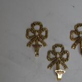 Trio of brass coat hooks