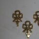 Trio of brass coat hooks
