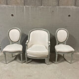 Armchair and 2 chairs set in Louis XVI style, light fabric, patinated wood.