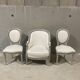 Armchair and 2 chairs set in Louis XVI style, light fabric, patinated wood.