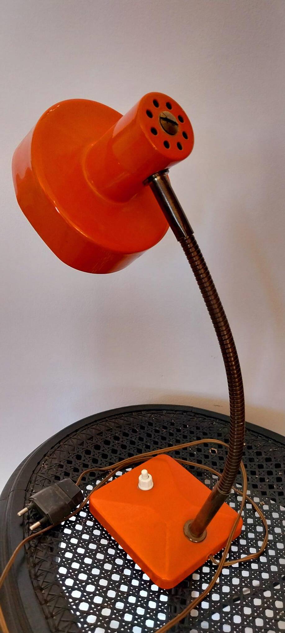Orange metal lamp from the 60s and 70s.