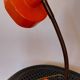 Orange metal lamp from the 60s and 70s.