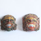 Two polychrome painted and gold leaf gilded Barong dance masks from Bali, Indonesia.