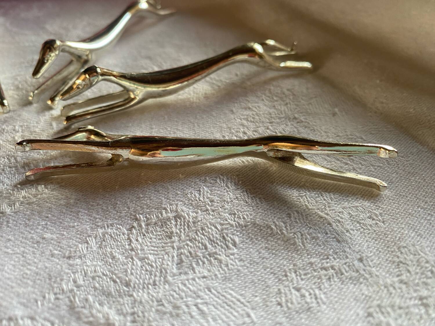 Set of 6 greyhound knife holders in silver metal