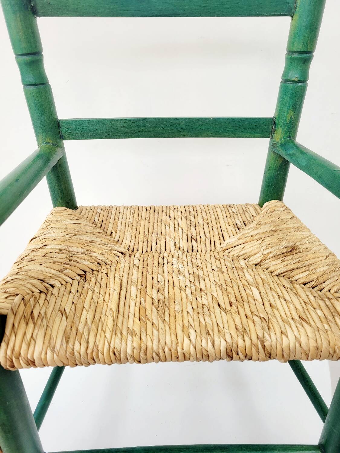 Small vintage children's chair in wood and green straw
