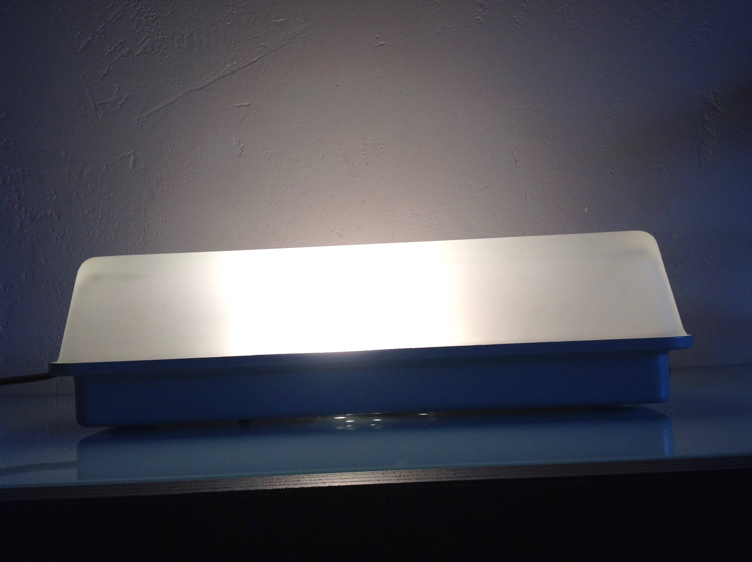 Rectangular porthole wall light in industrial/70s style frosted glass