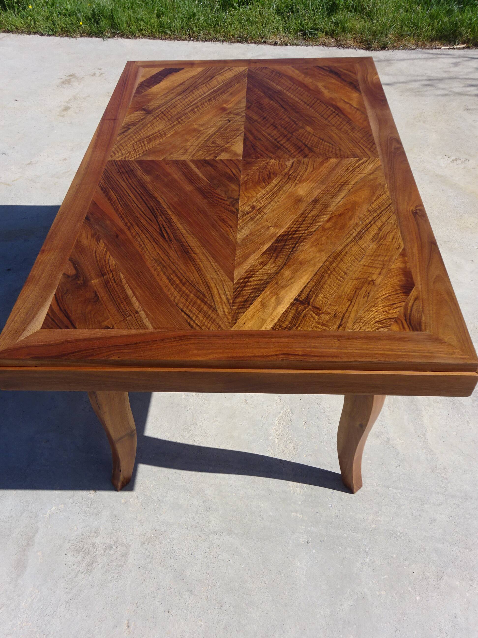 Antique solid walnut table with marquetry and extensions.