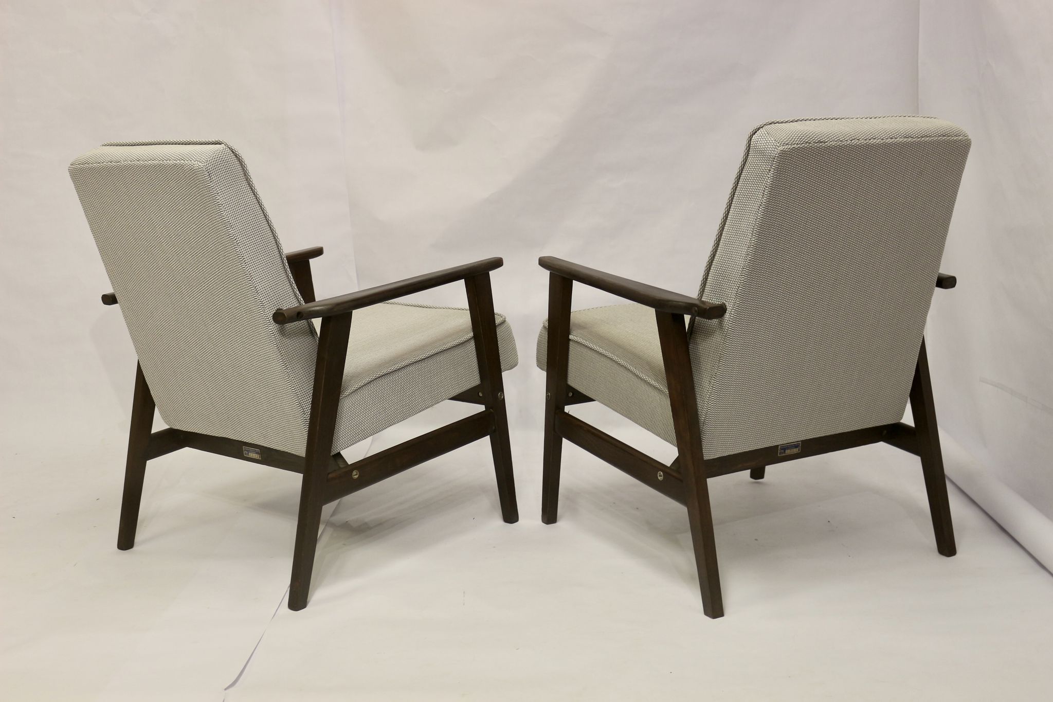 Pair of Henryk Lis armchairs 300-190s 1970s reupholstered gray textured fabric.