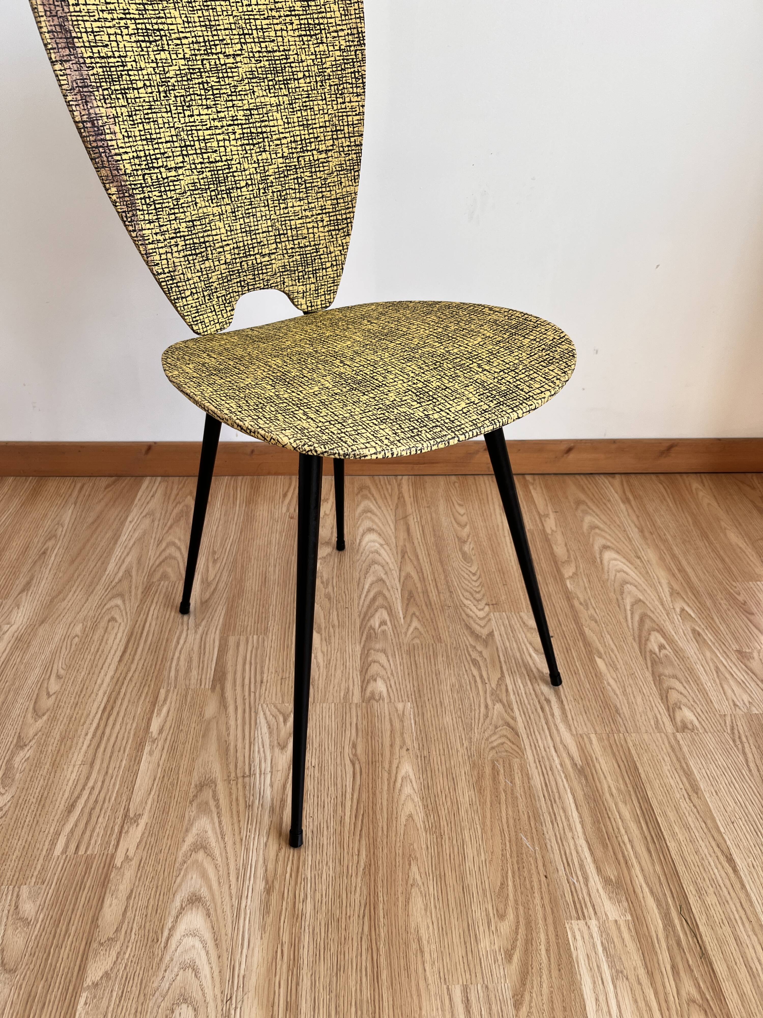 Faux leather chair assigned to Hitier.