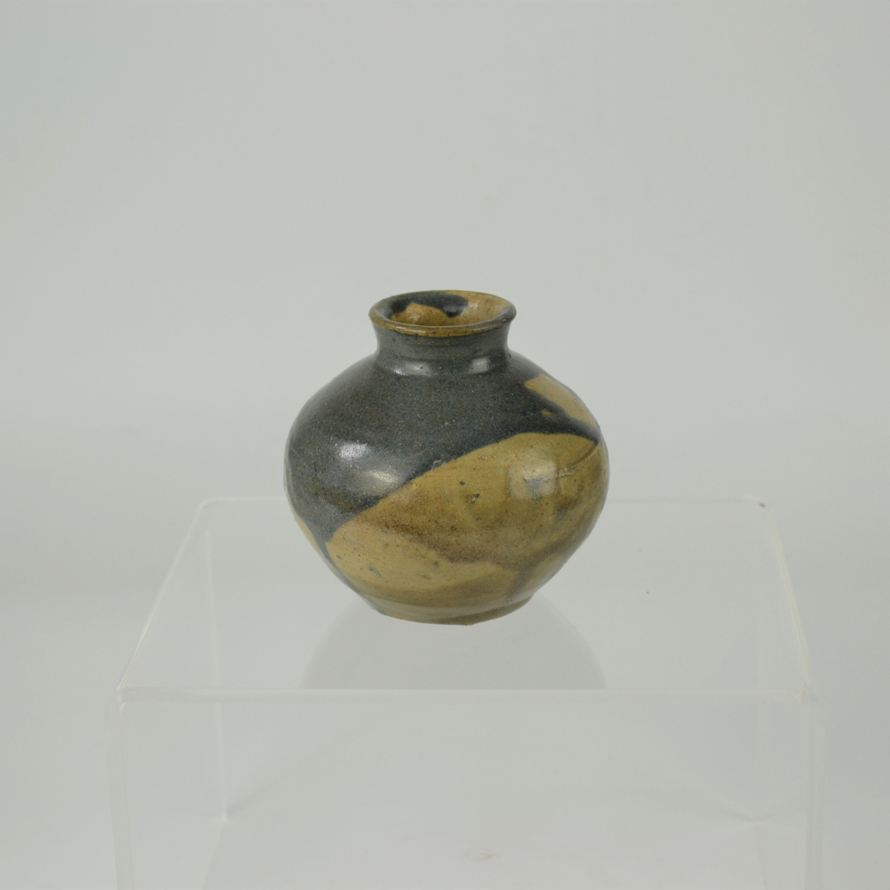 Sandstone ball vase by Eugène Lion