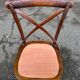 4 bistro chairs with curved wooden backs and cross braces / Crossback