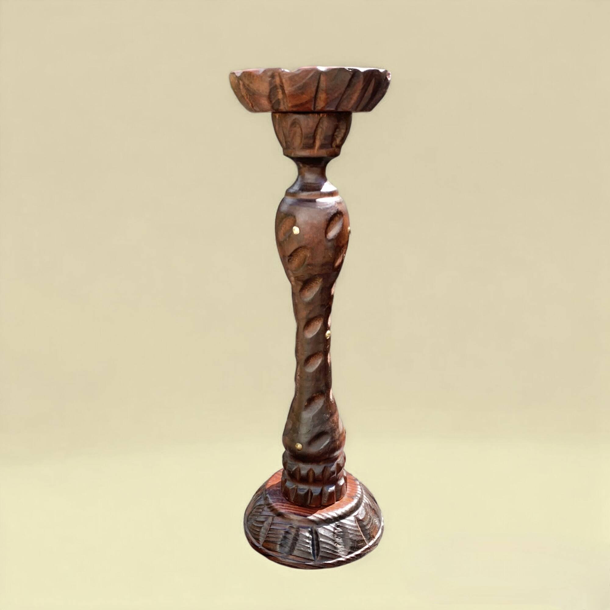 Old ashtray on carved wooden stand