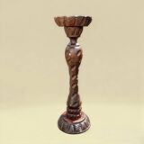 Old ashtray on carved wooden stand