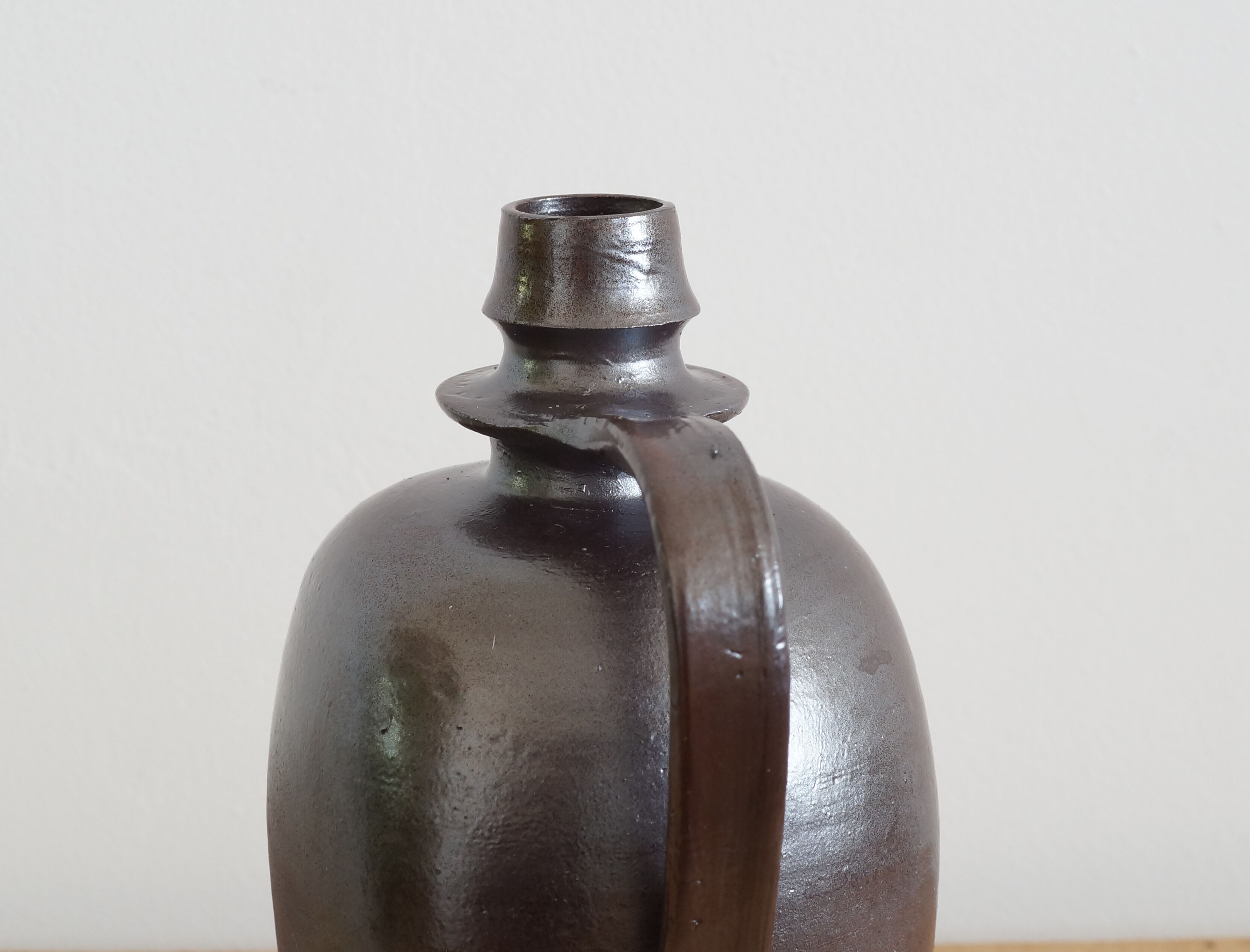 Old Norman bottle in brown ceramic