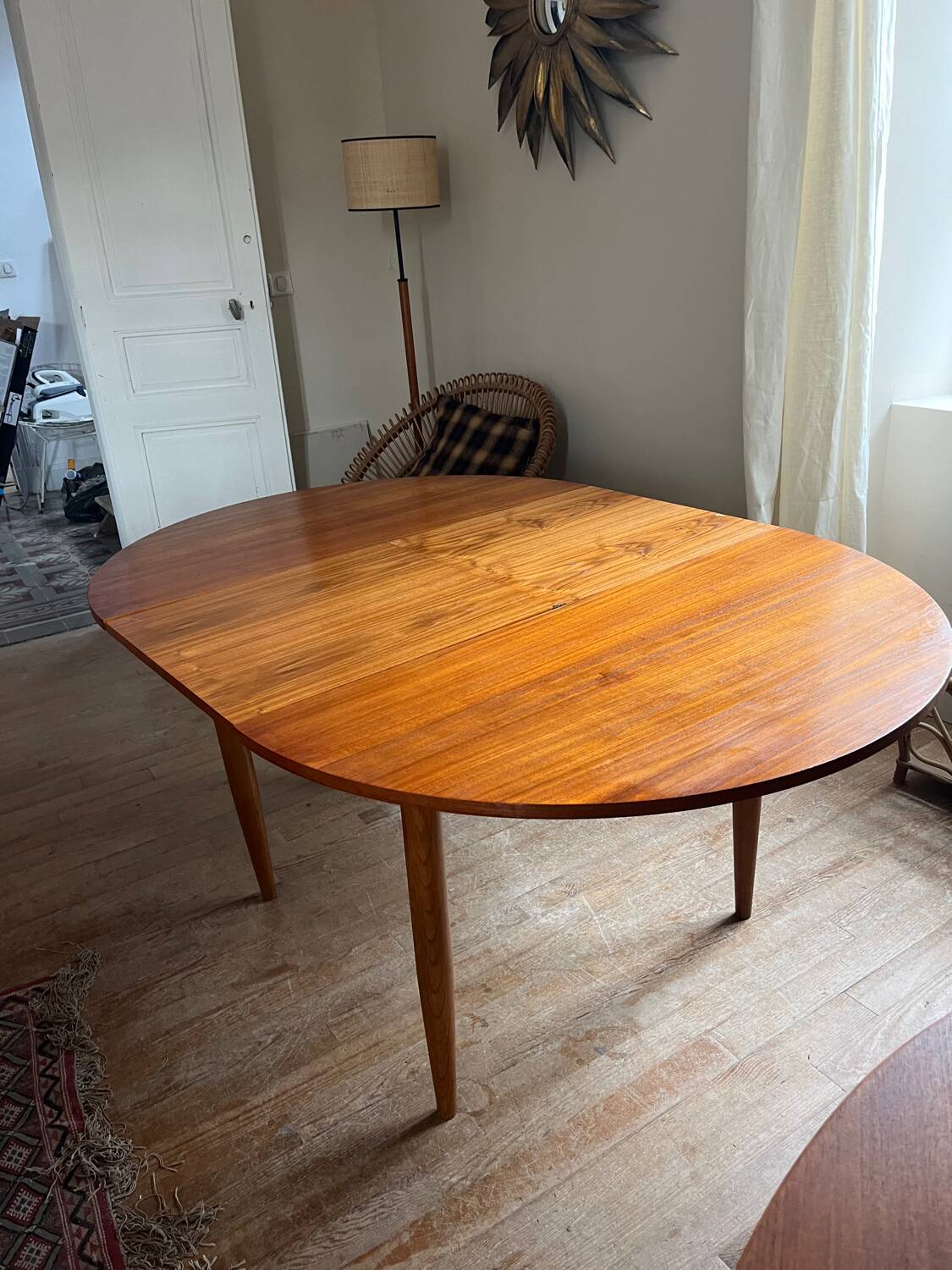 Scandinavian round teak table with butterfly extensions from the 60s