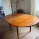 Scandinavian round teak table with butterfly extensions from the 60s
