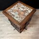Rotating walnut library with a marble top.