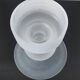 Sculptural candle holder in frosted glass.