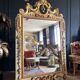 Italian mirror from the Napoleon III period in painted and gilded wood
