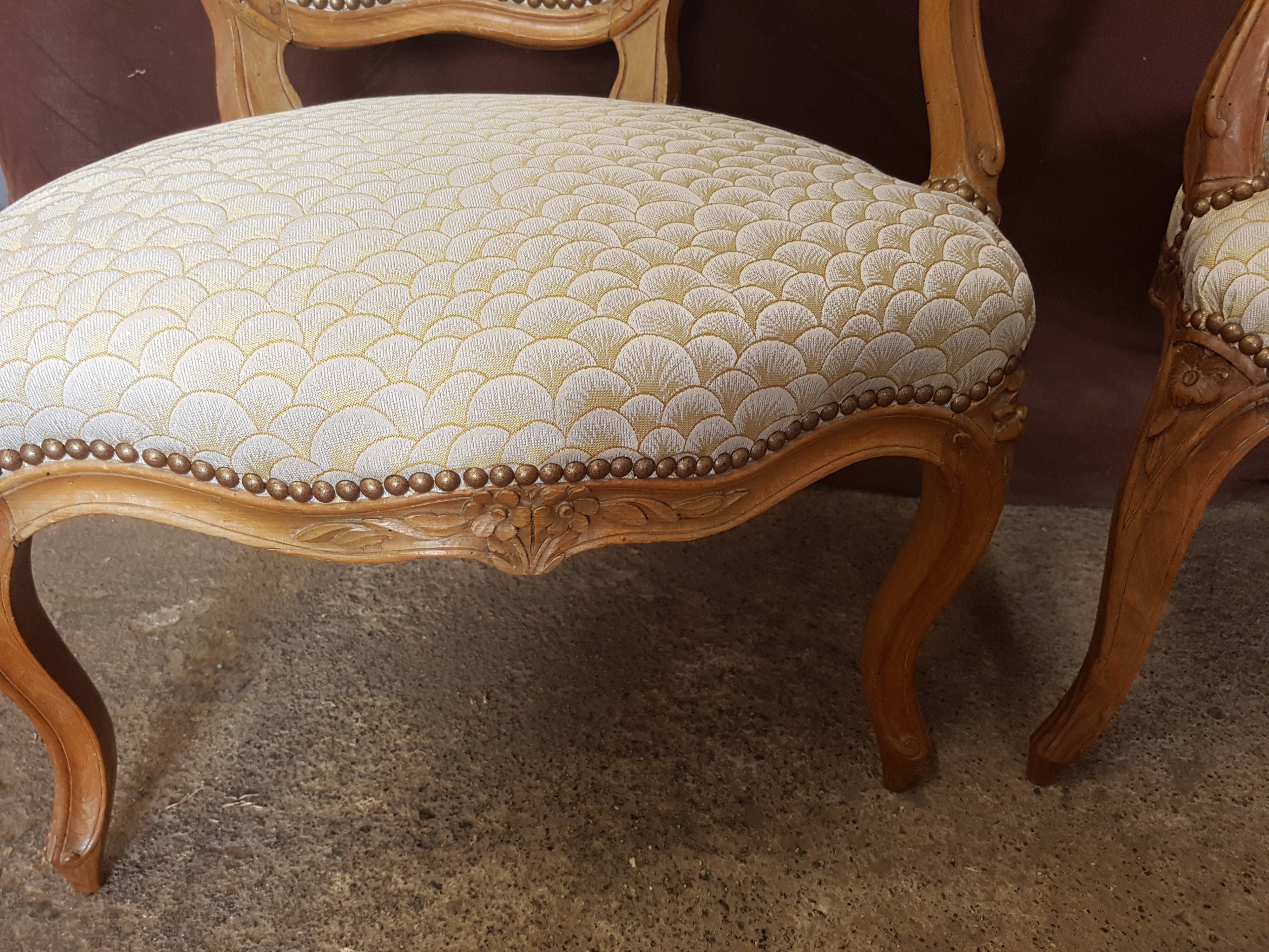 Pair of Louis XV-era convertible armchairs