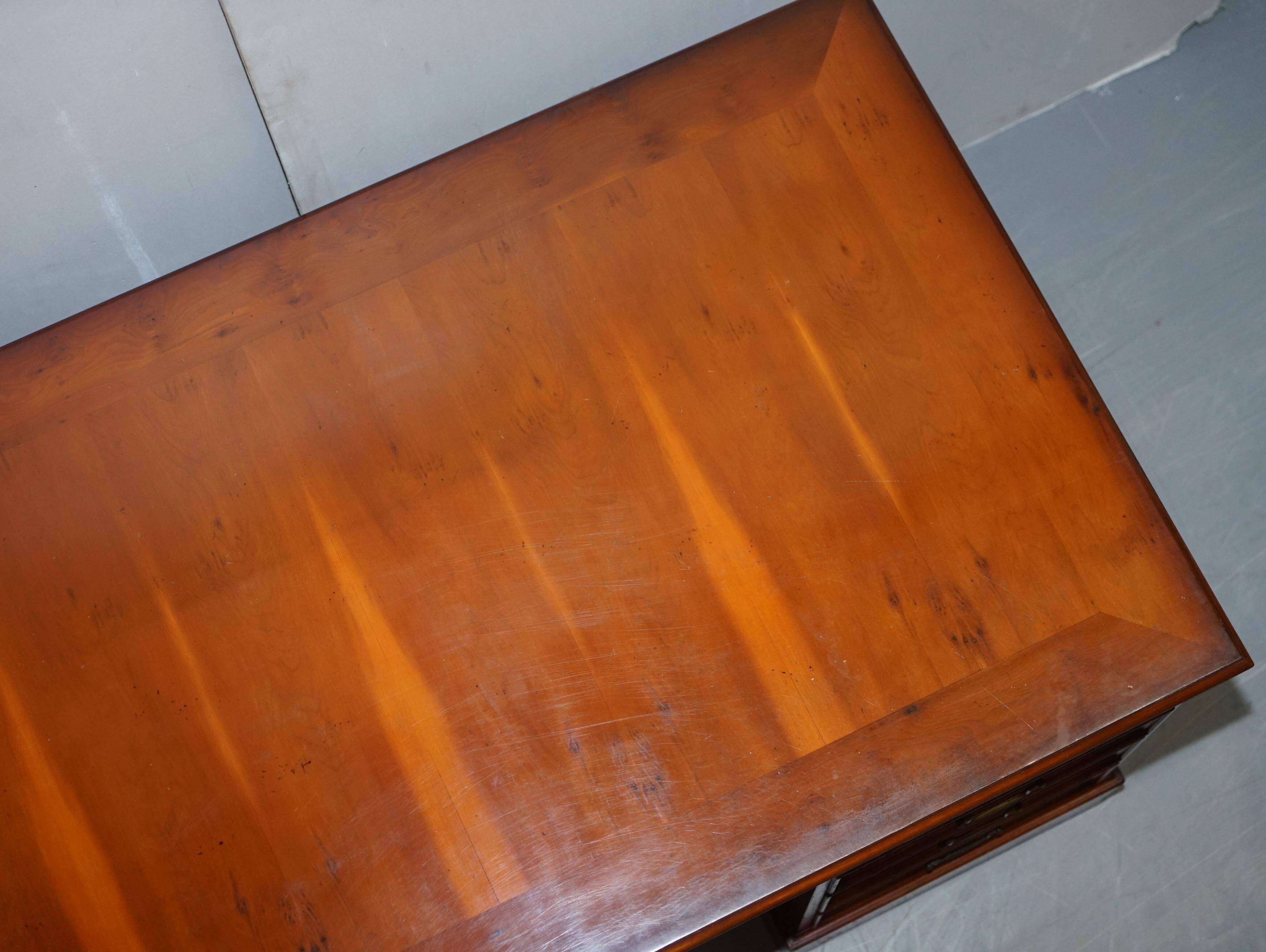 Partner desk with double pedestal in burr yew wood with decorated top.