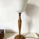 Large Art Deco lamp in Mazda style made of turned wood and opaline.