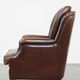 Vintage sheepskin armchair in a dark cognac colour with a comfortable seat