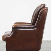 Vintage sheepskin armchair in a dark cognac colour with a comfortable seat