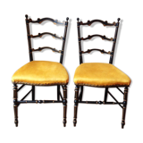 Paire de chaises noir et or