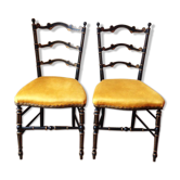 Paire de chaises noir et or